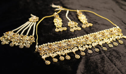 Champagne color kundan choker set with jhoomar and tikka